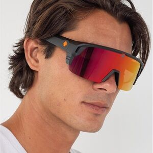 Spy Monolith 5050 matte black sunglasses with lens scratches but still visible.